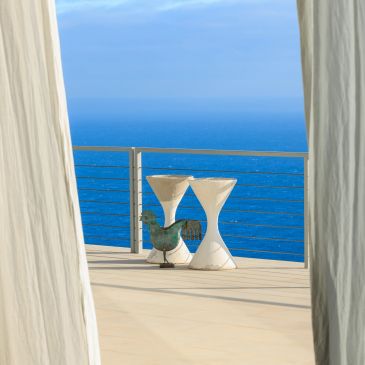 Coastal scene with white curtains